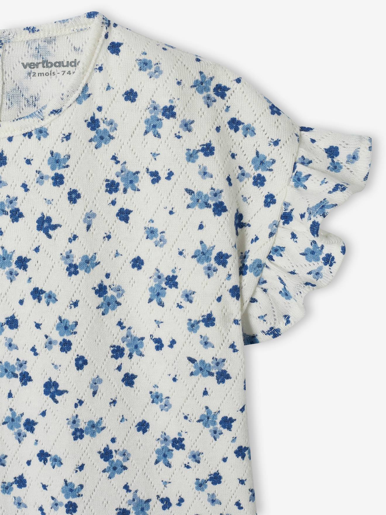 Camiseta infantil de malha aberta com estampa floral.