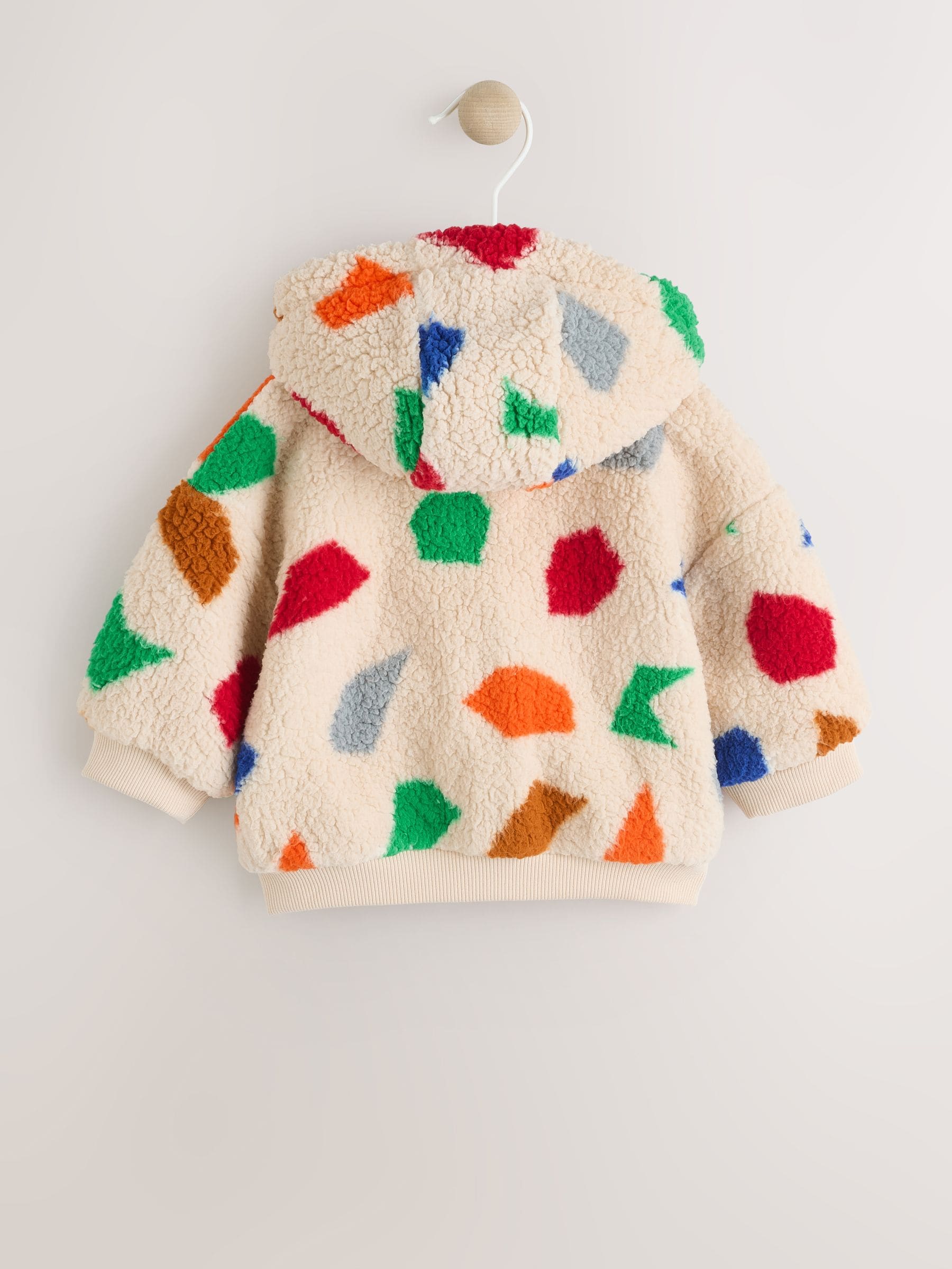 Natuurlijk felgekleurd met geometrische print - Babyjack met rits en capuchon (0mnd-2jr)