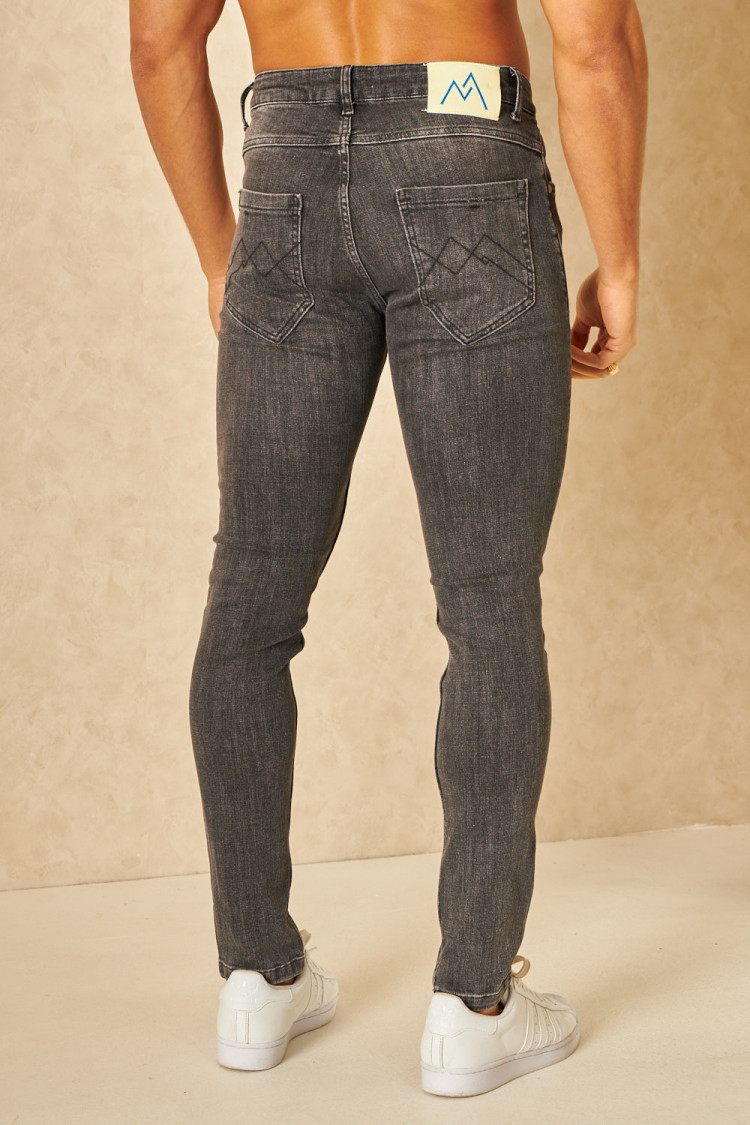Jeans slim noir délavé déchiré