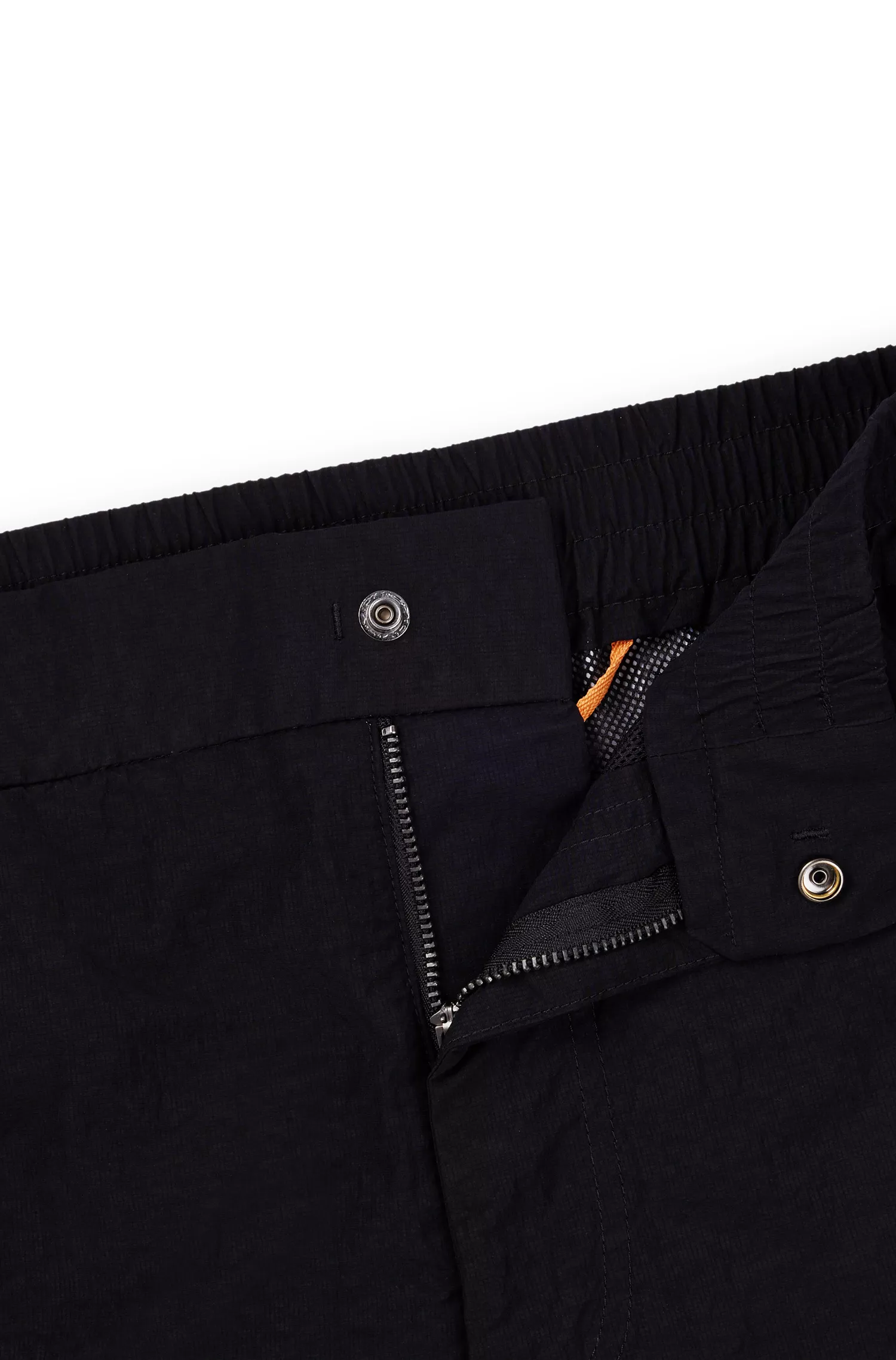 Calça BOSS laranja, corte relaxado, em tecido ripstop repelente à água.