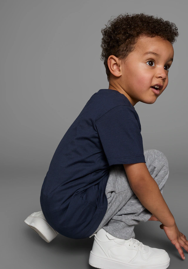 KIDSWORLD T-Shirt Kurzarm,  Basic-Passform,  mit stylischem Druck,  mit Rippbündchen