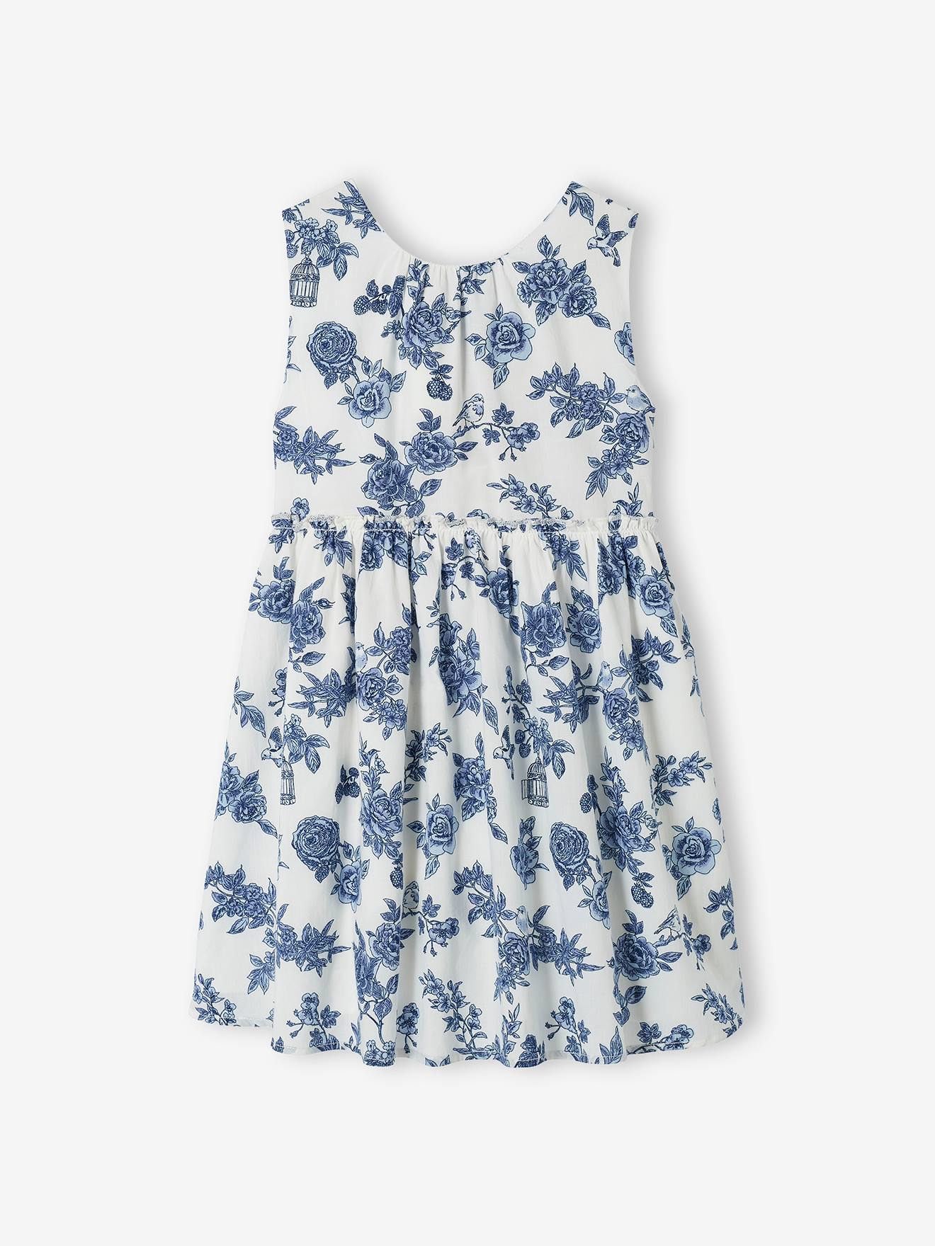 Vestido de festa infantil com flores e laço nas costas, na cor branco-creme.
