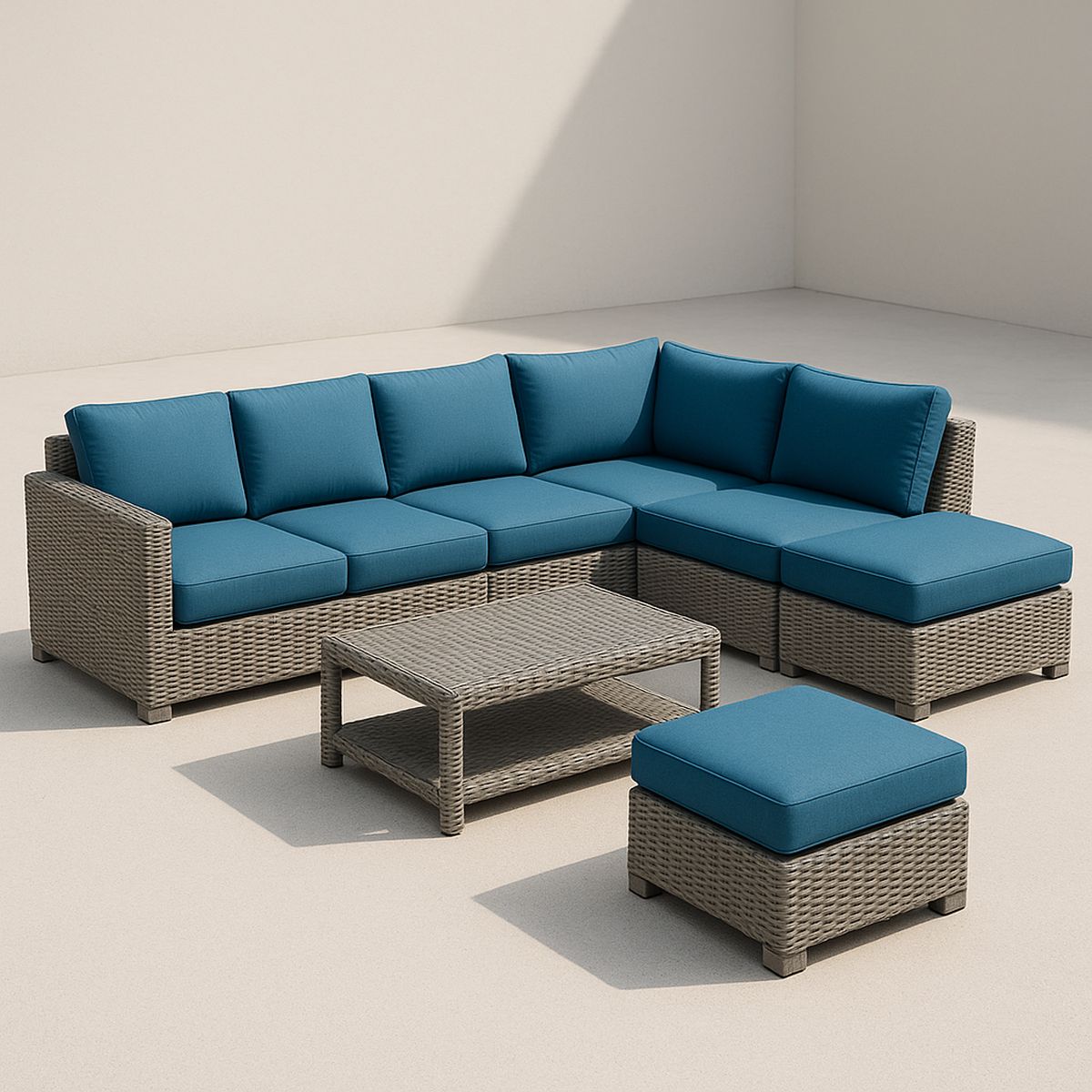 Ecksofagarnitur aus Polyrattan mit blauen Polyesterkissen