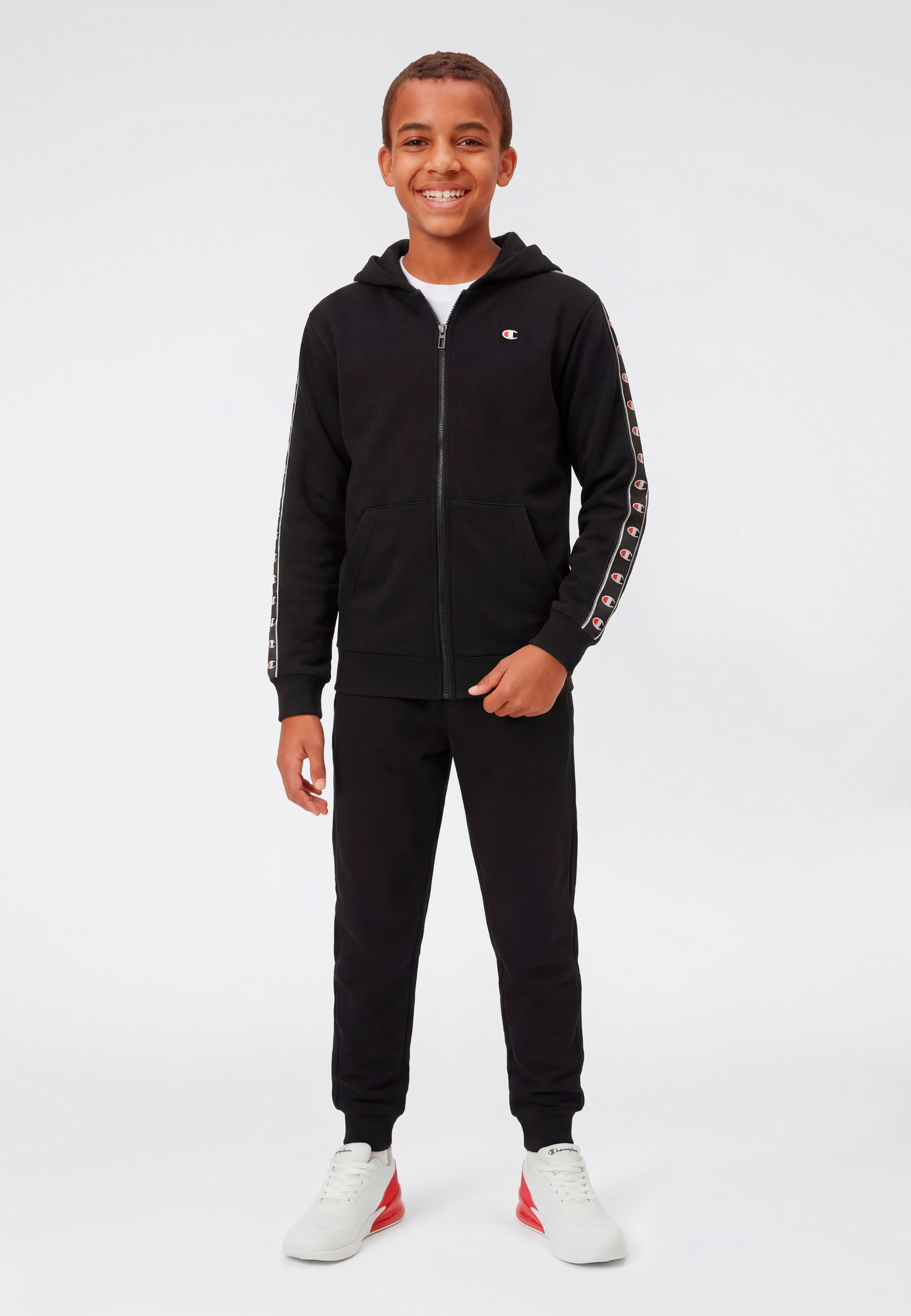 Champion Jogginganzug »Sport inspired Hooded Full Zip sweatsuit« 2 tlg. mit Kapuze, mit durchgehendem Reissverschluss, für Kinder