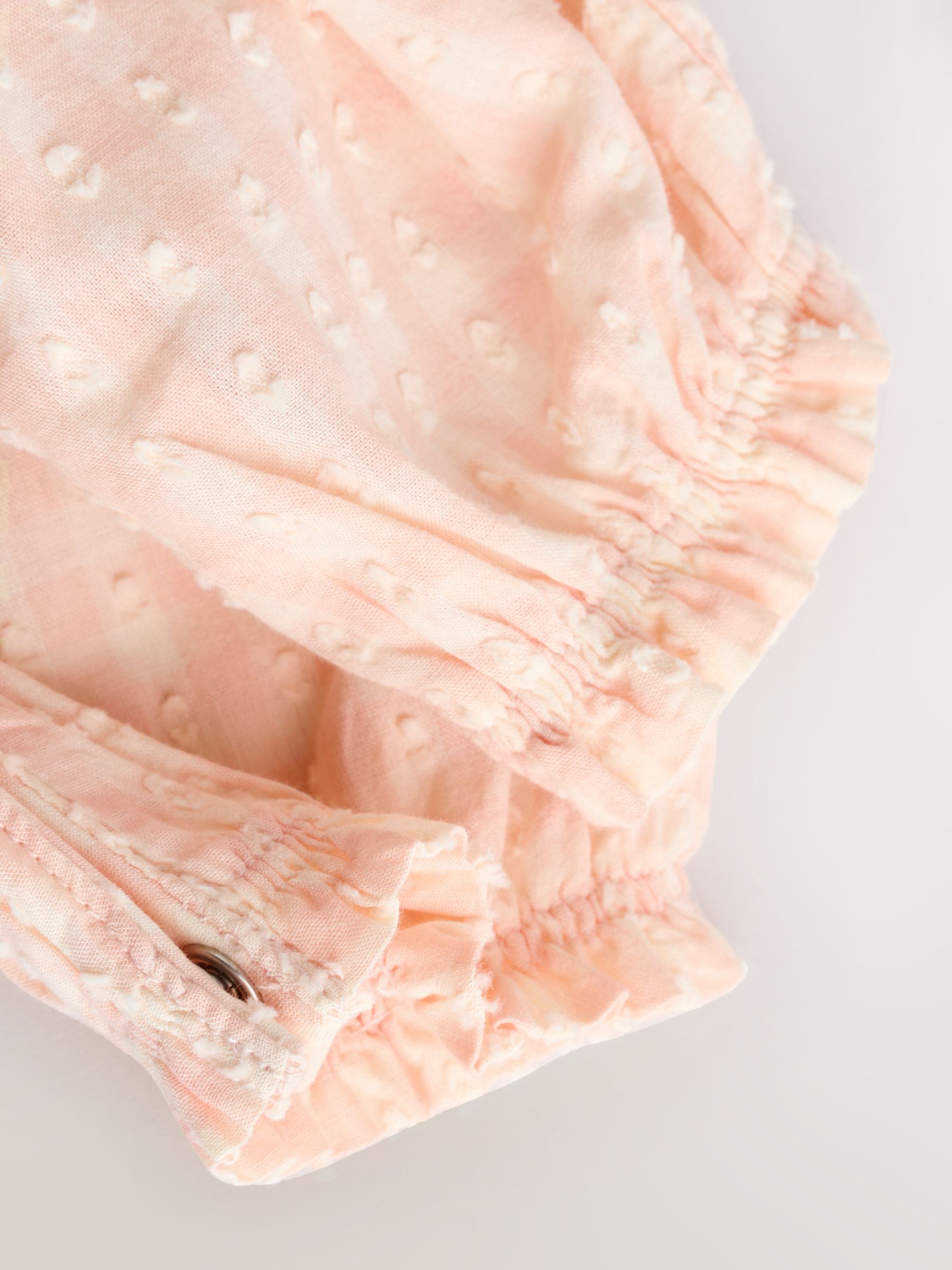 Perzikroze gingham-ruit - Babyromper met ruches (0mnd-2jr)