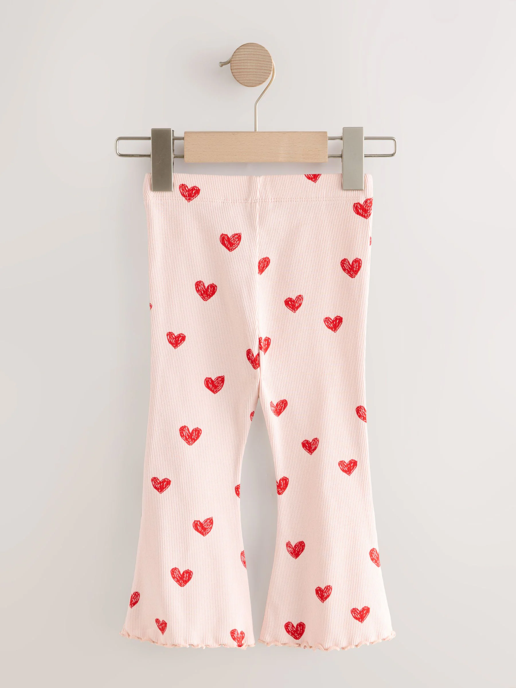 Lichtroze met hartje - Geribbelde flare legging (3 mnd-7 jr)