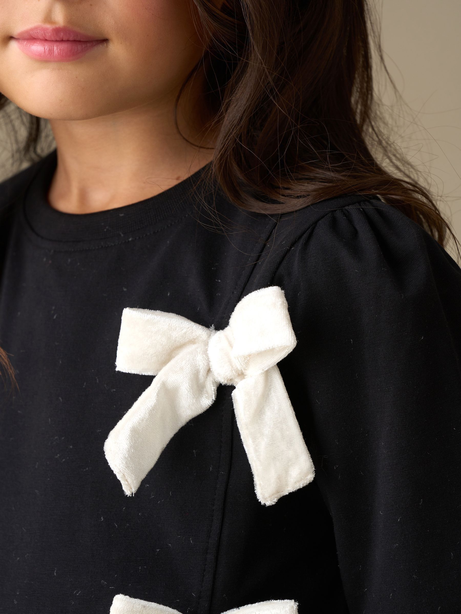 Angel & Rocket Eliza Asymmetric Bow Long Sleeves Top