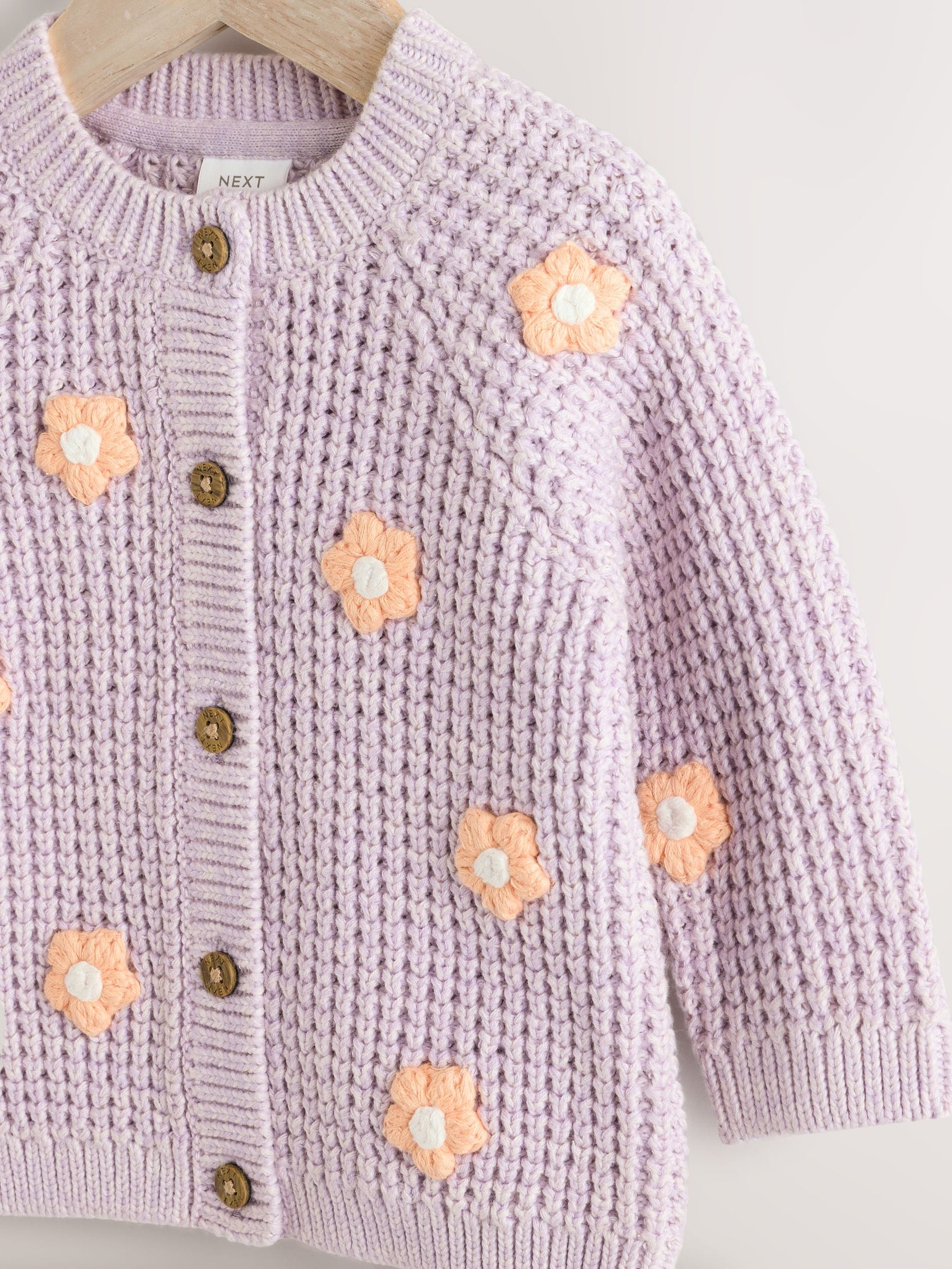 Paarse en abrikozenkleurige bloemen voor baby's - Geborduurd vest (0 mnd - 2 jr)
