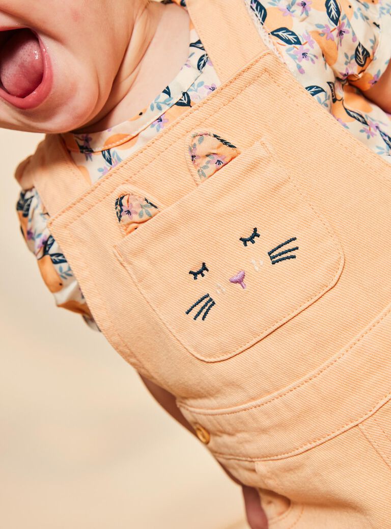 Salopette orange clémentine en twill à découpe oreilles de chat