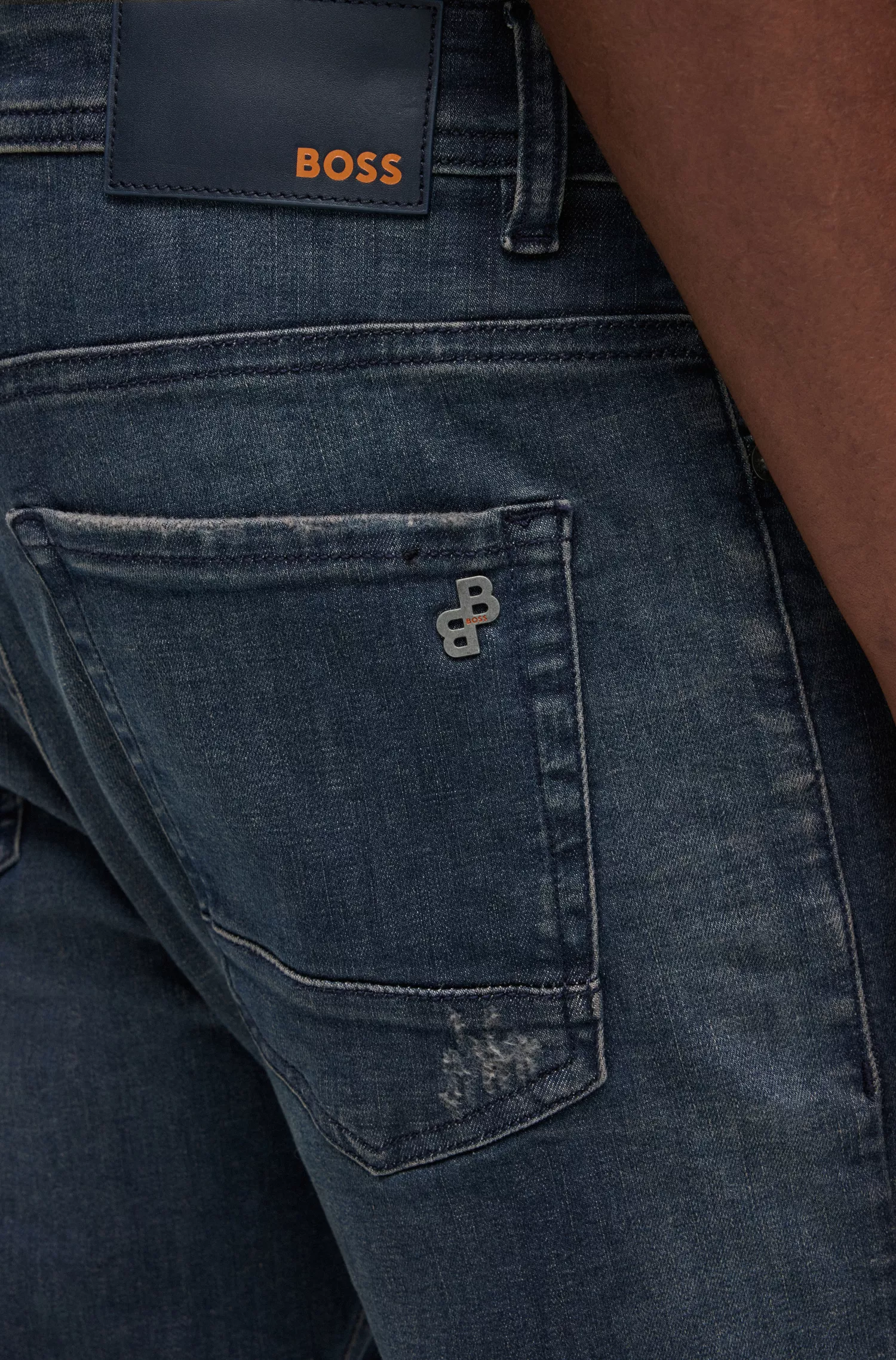 Calça jeans BOSS laranja com corte afunilado em denim superelástico com tonalidade cinza.