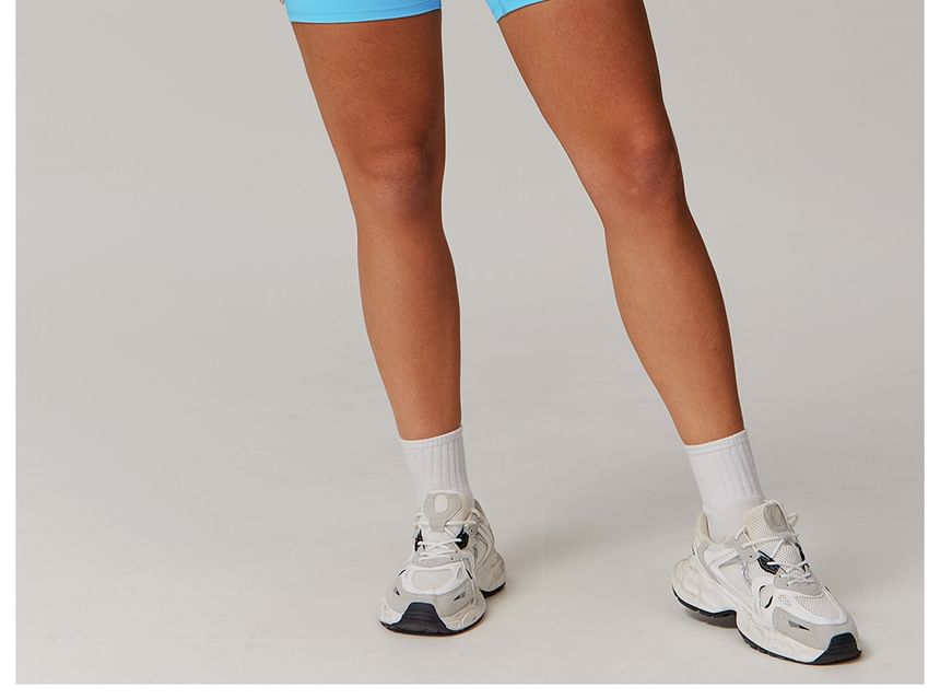 Skinniano - Sporttop met vierkante hals en effen crop top