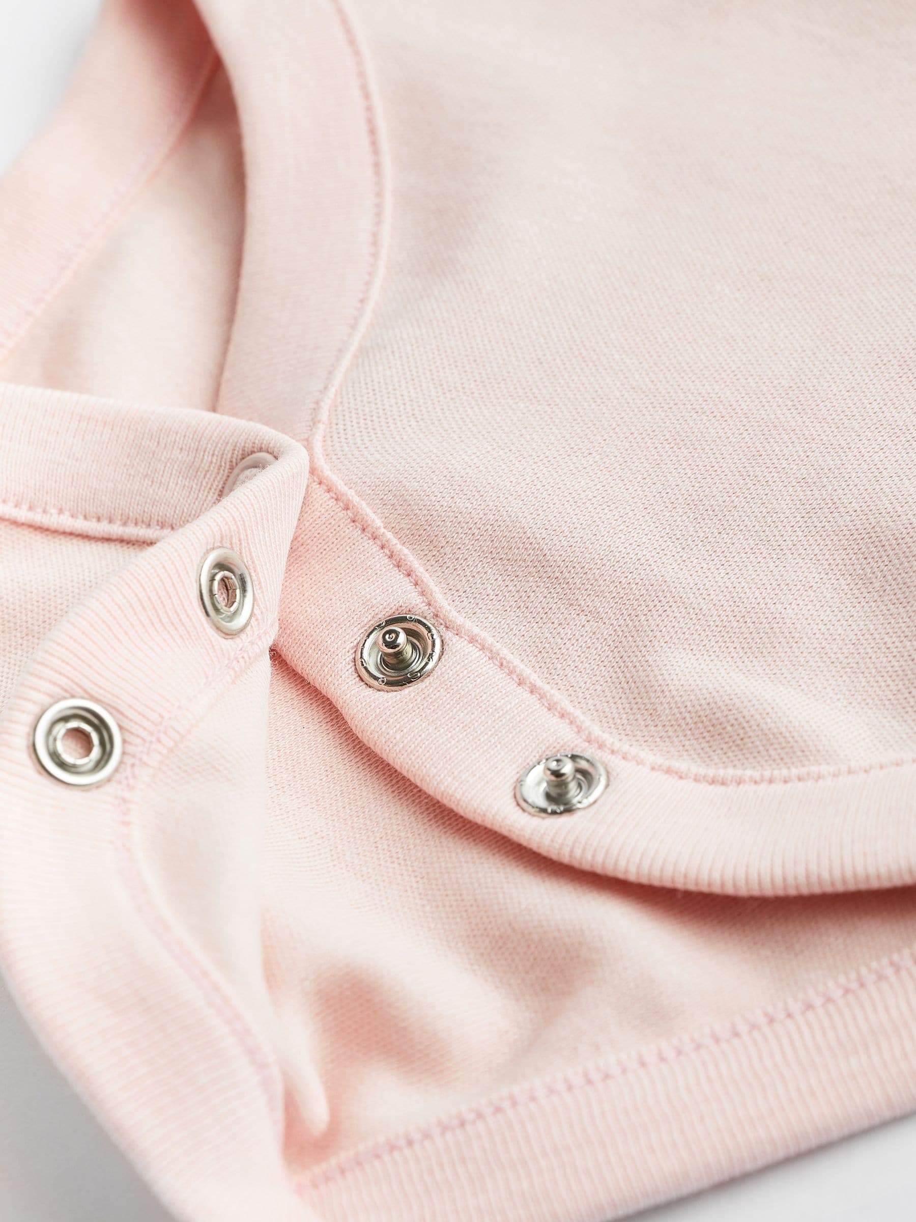 Roze/wit - Onmisbare rompertjes met lange mouwen