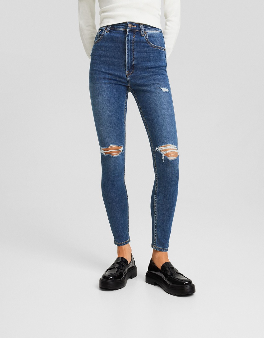 Calça jeans skinny de cintura super alta e rasgada