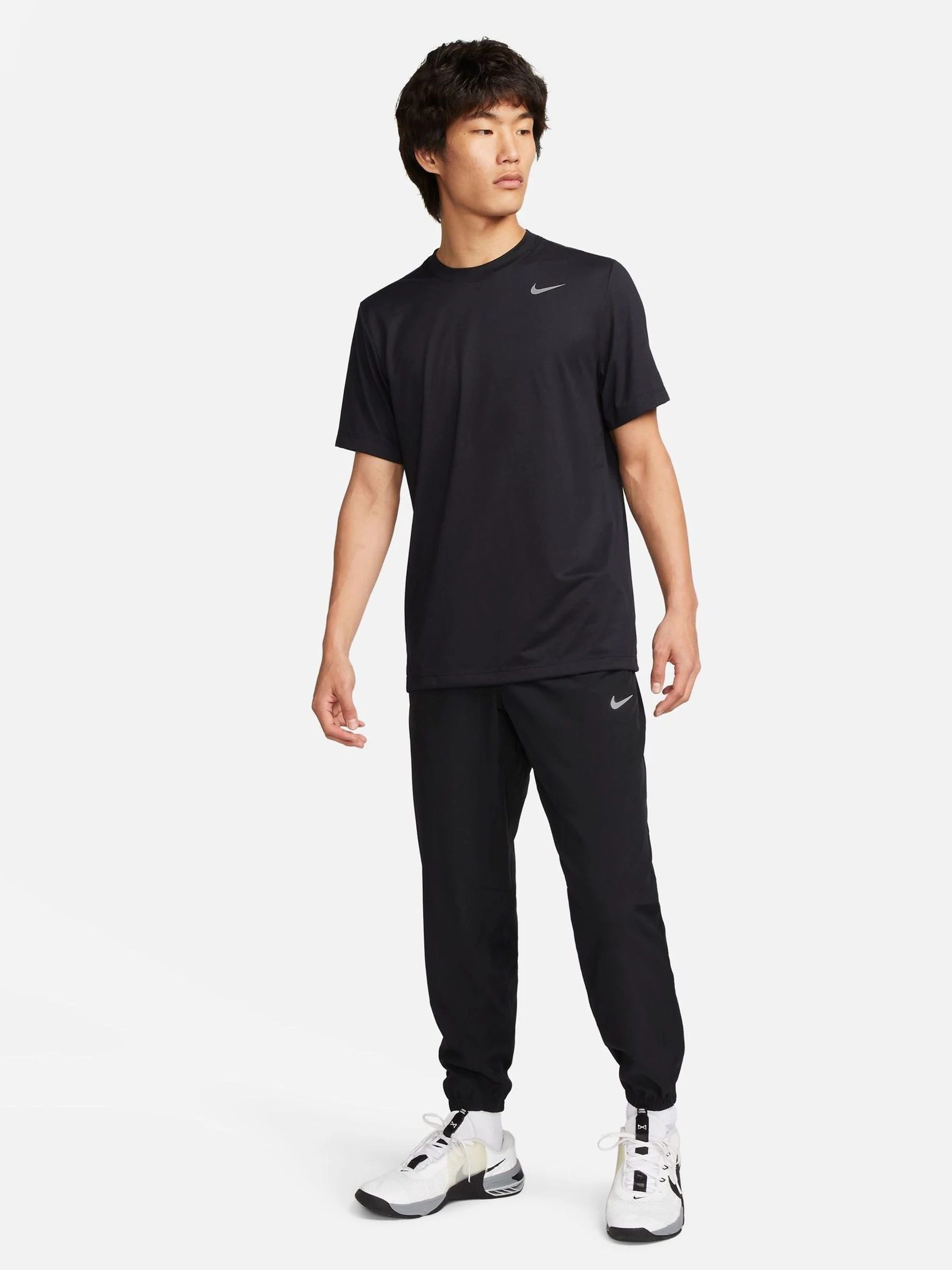 Zwart - Nike Dri-FIT Form trainingsbroek met taps toelopende pijpen