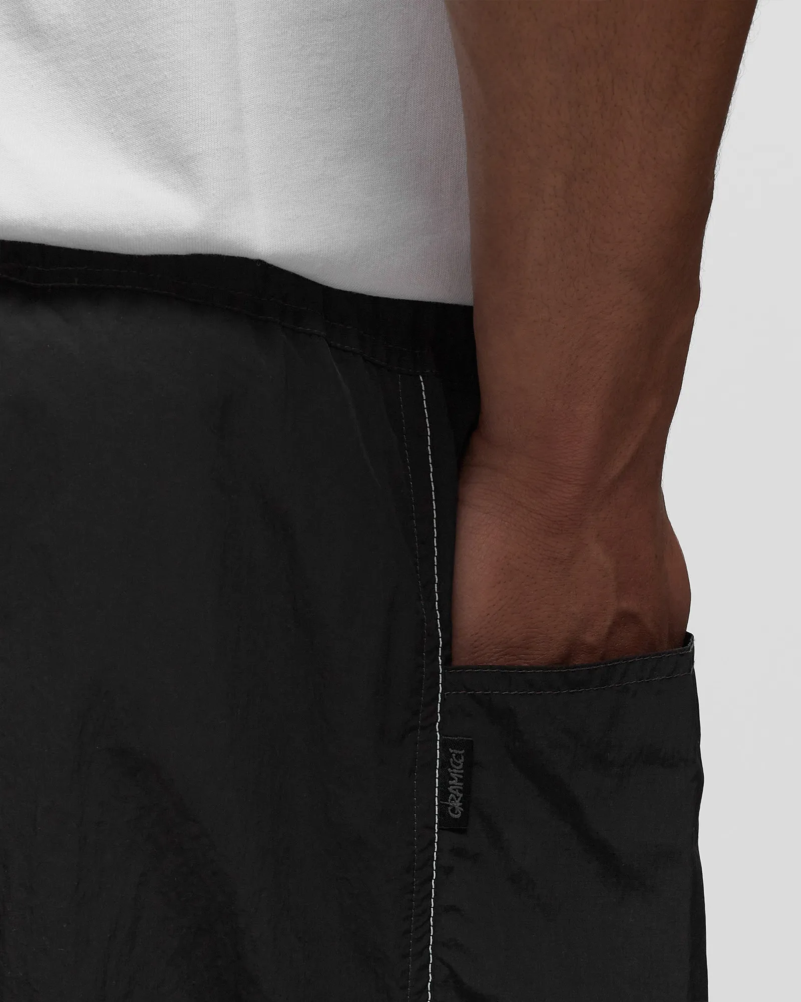 Gramicci x AND WANDER PATCHWORK WIND PANT