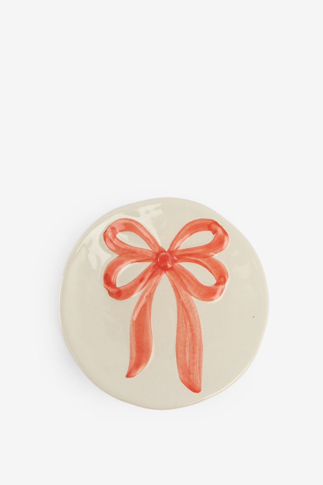 Beige dessertbord met roze strik