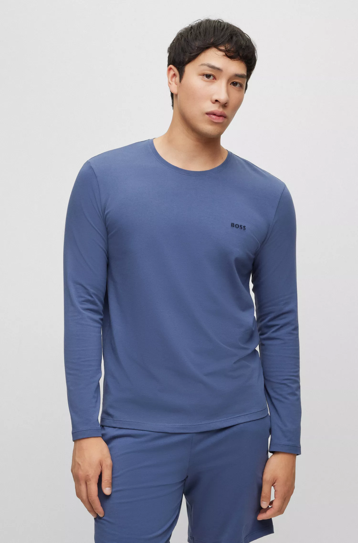 Camiseta de descanso BOSS com logo preto bordado, em malha de algodão stretch.