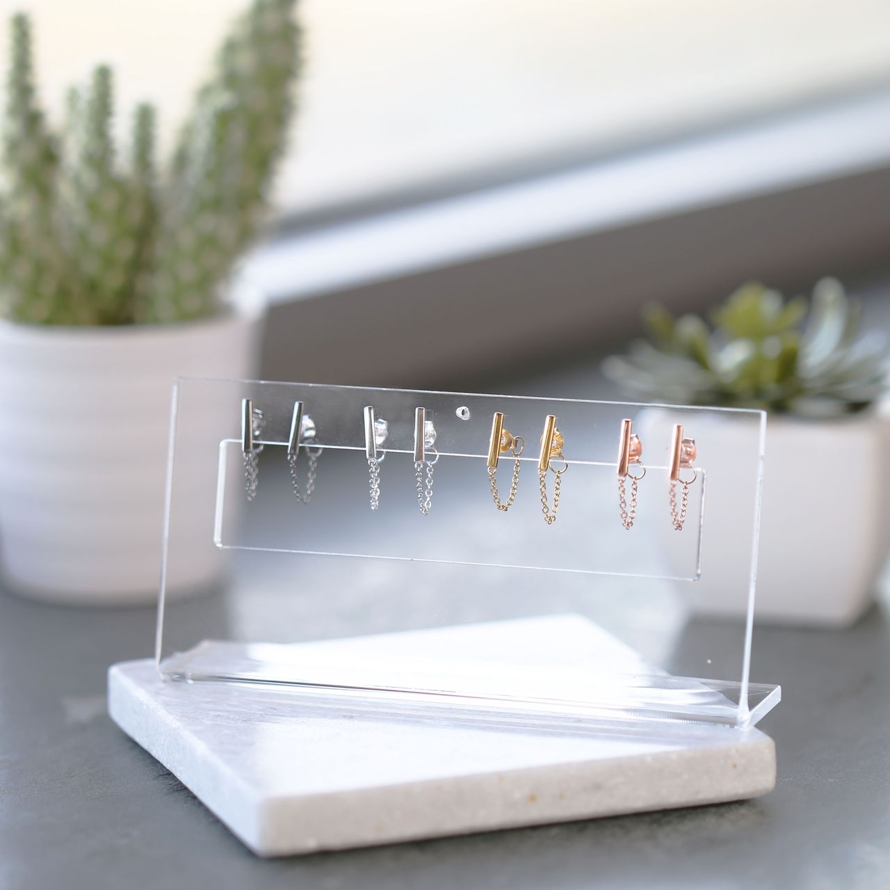 Zilveren oorbellen roseplated bar ketting