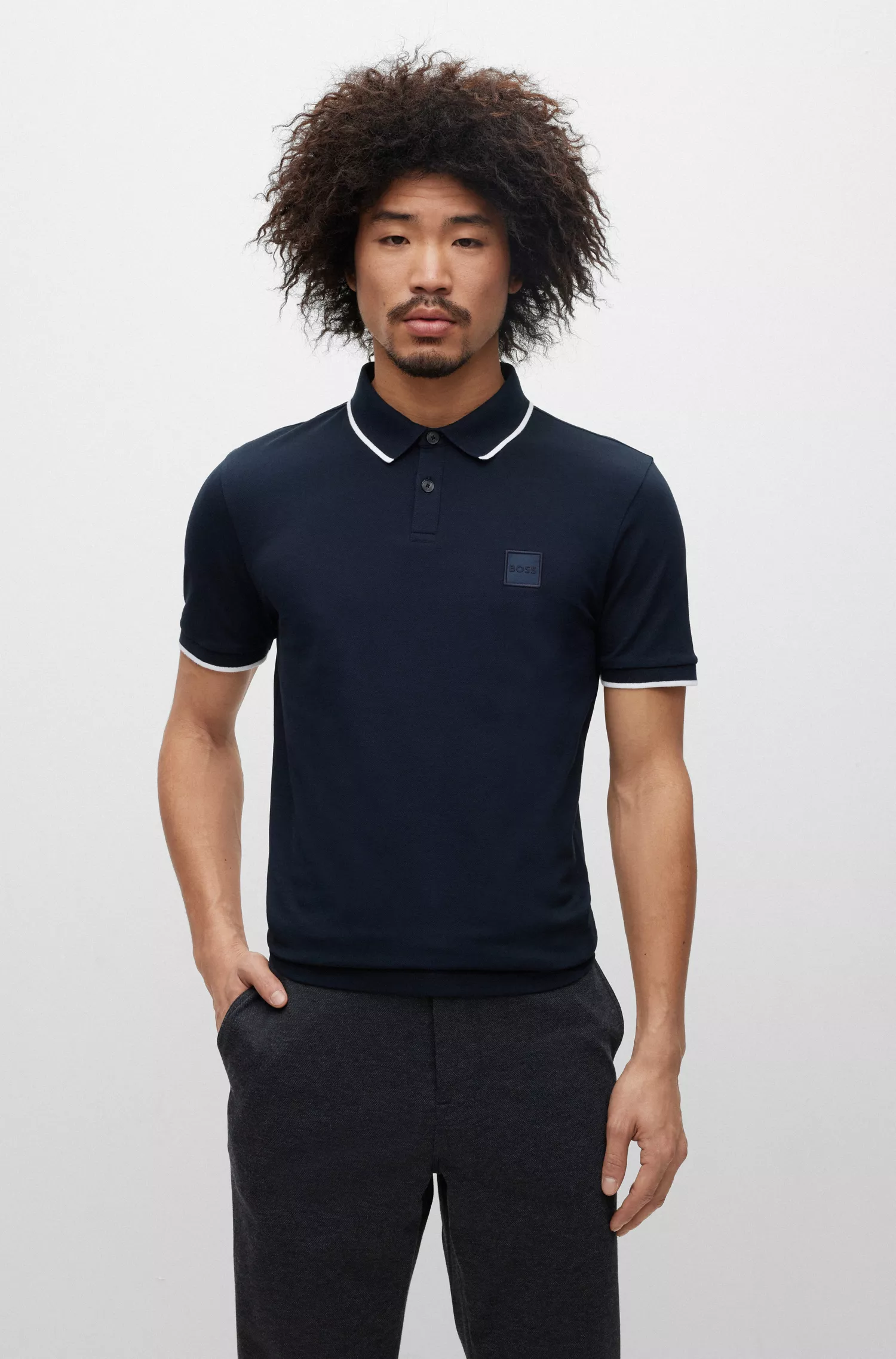 Camisa polo BOSS laranja, de algodão stretch, corte slim, com etiqueta de logotipo.