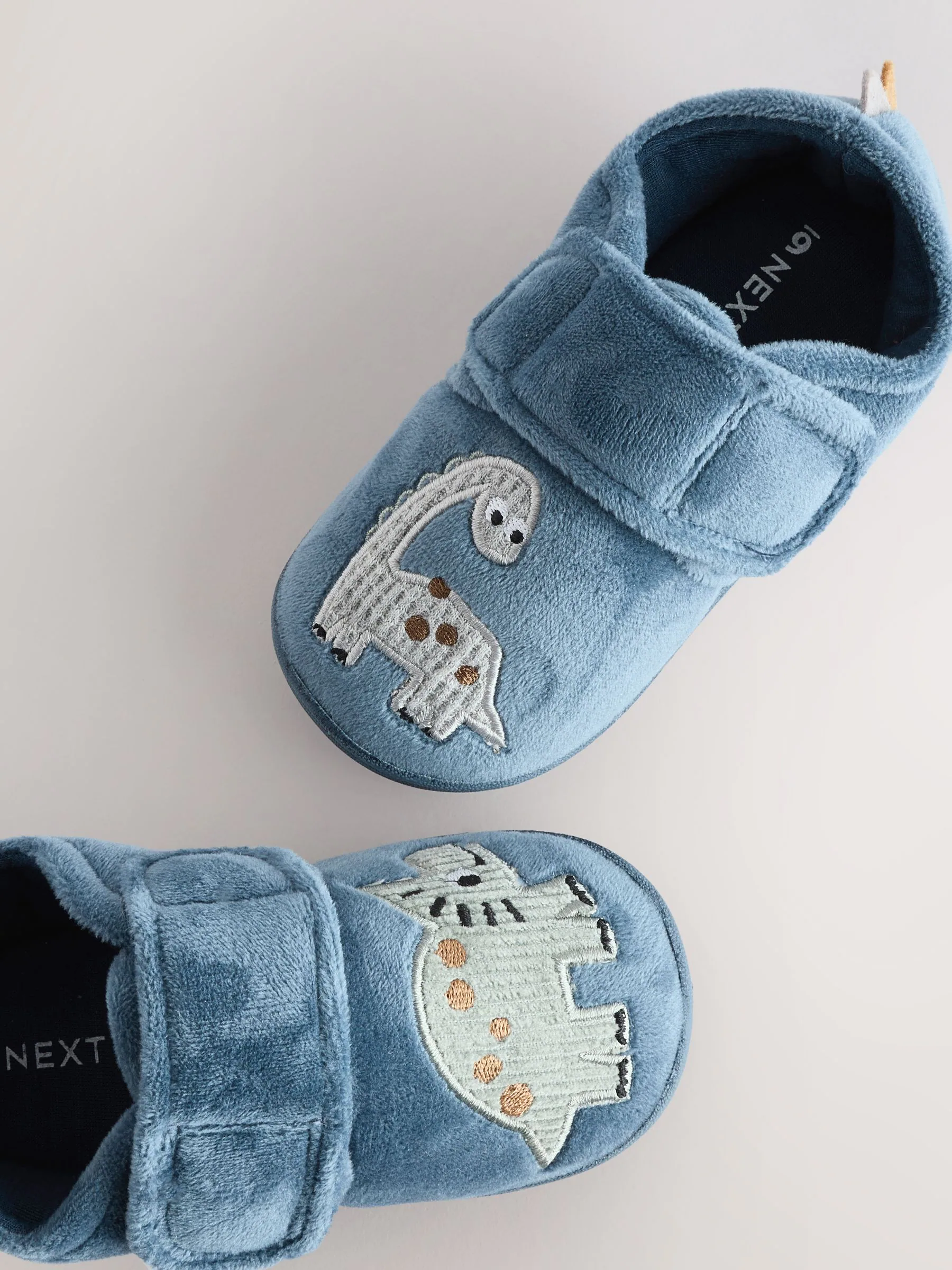 Blauw met dinosaurus - Warm gevoerde pantoffels met kuipzool