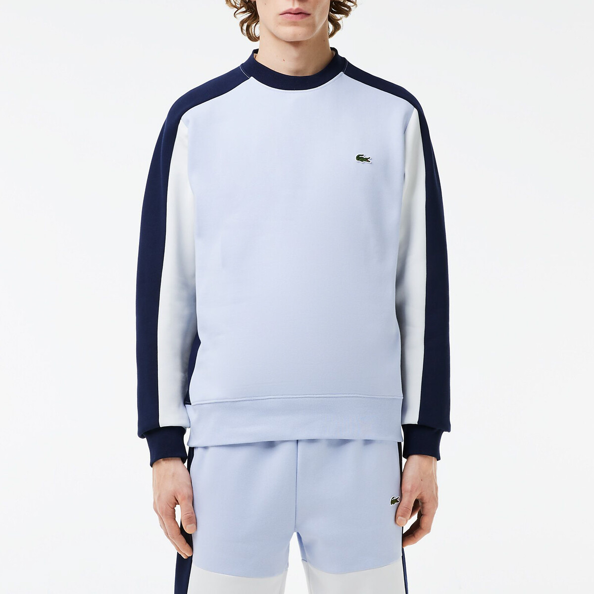 Suéter LACOSTE com gola redonda e blocos de cor, em fleece.