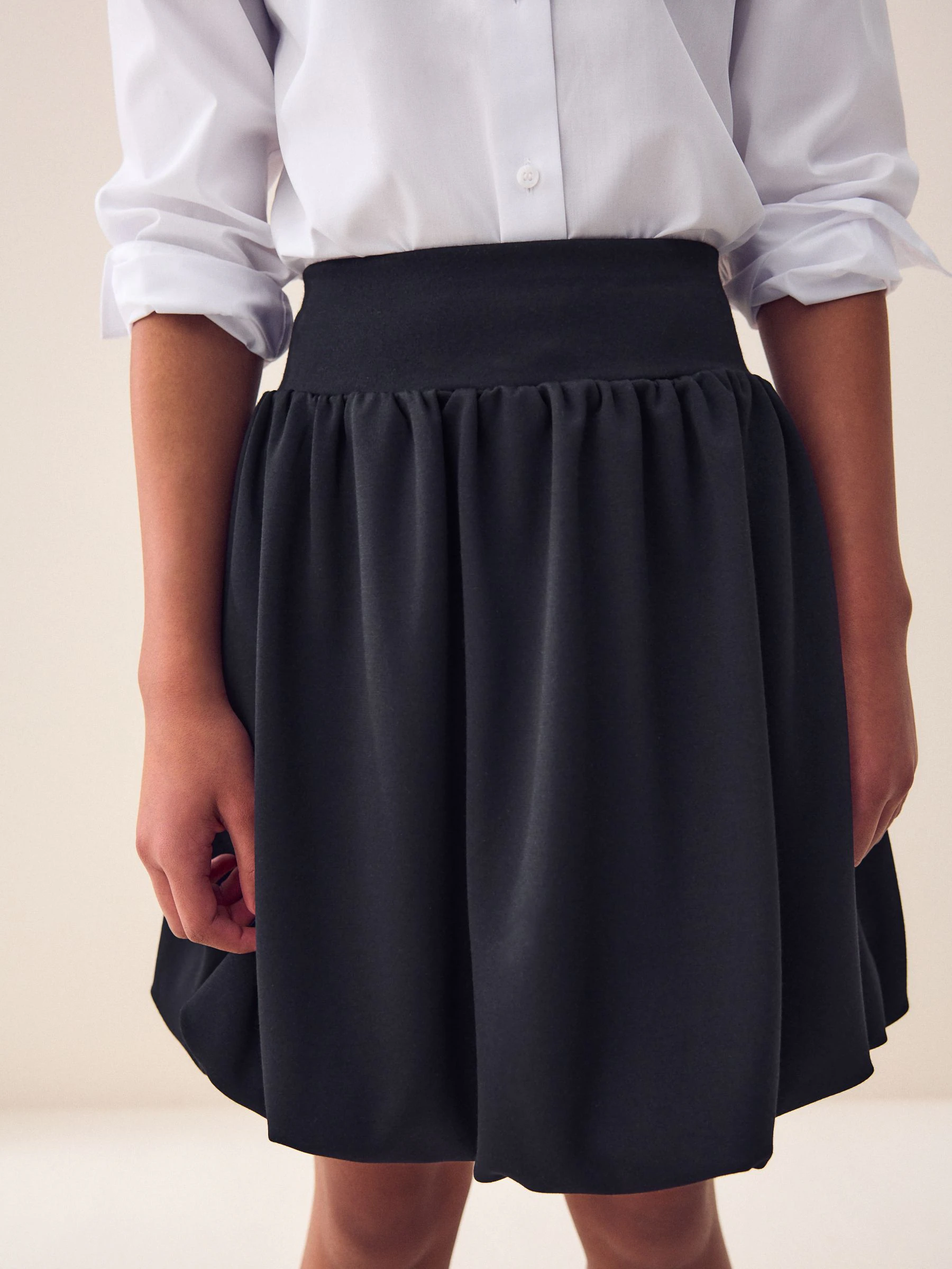 Zwart - Jersey stretch rok met ballonzoom en elastische taille (3-17jr)