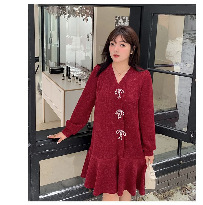 Tripoly - Plus-size lange mouwen V-hals glitter strik smockjurk