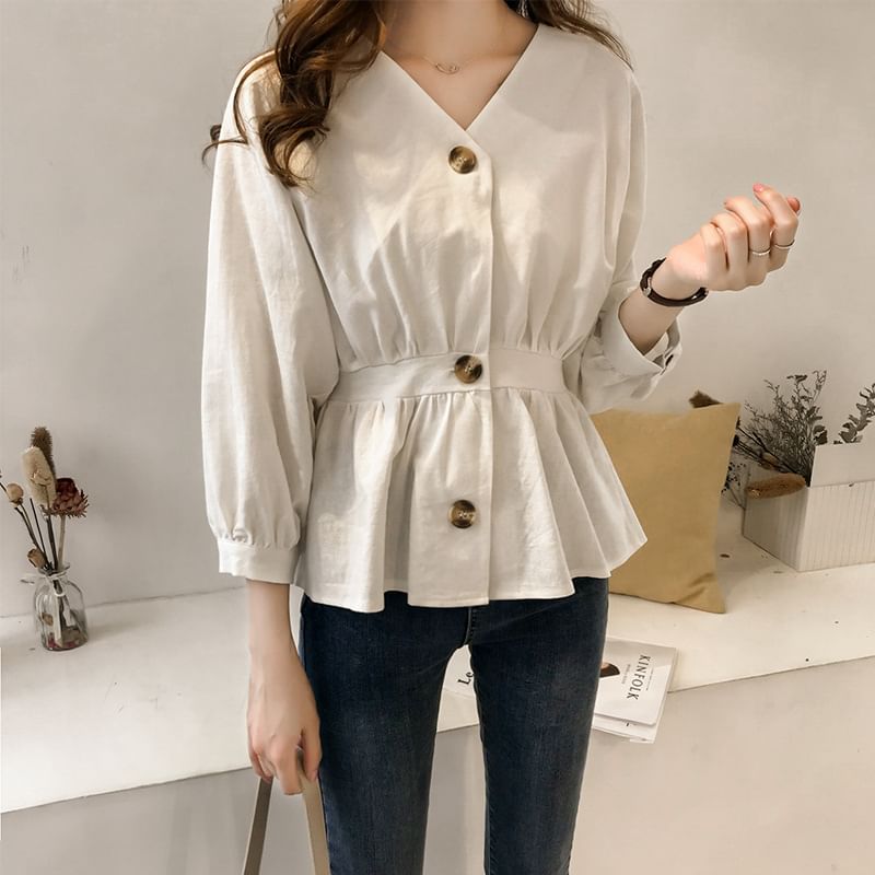 Areumdaun - Blouse met pofmouwen, V-hals en effen peplum