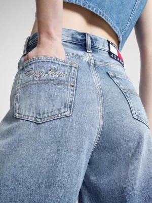 Calça jeans Claire de cintura alta, pernas largas e rasgos.