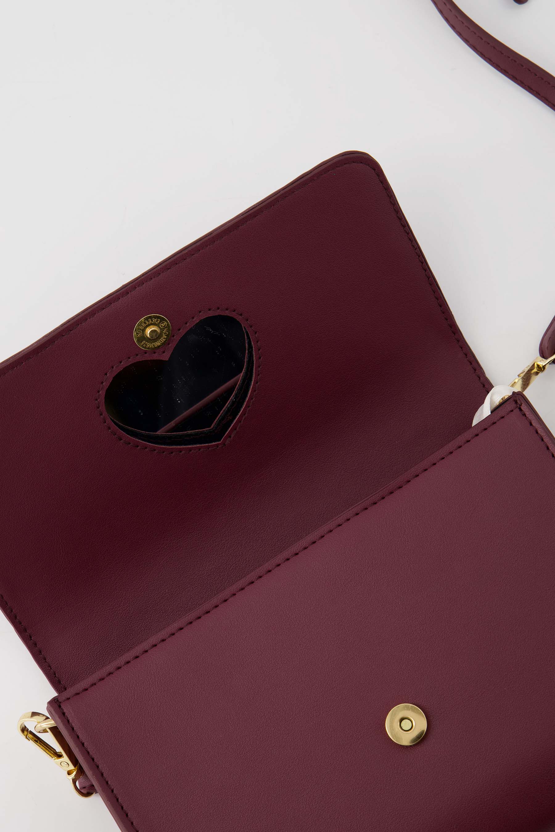 clutch met hart spiegel