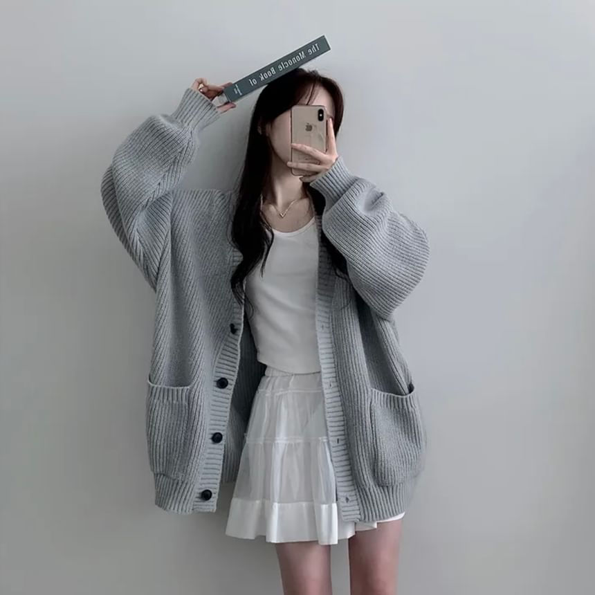 Coris - Oversized vest met pofmouwen, V-hals en effen zakdetail