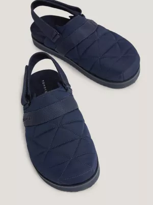 Sandálias mule com solado de couro reciclado e forro quente.