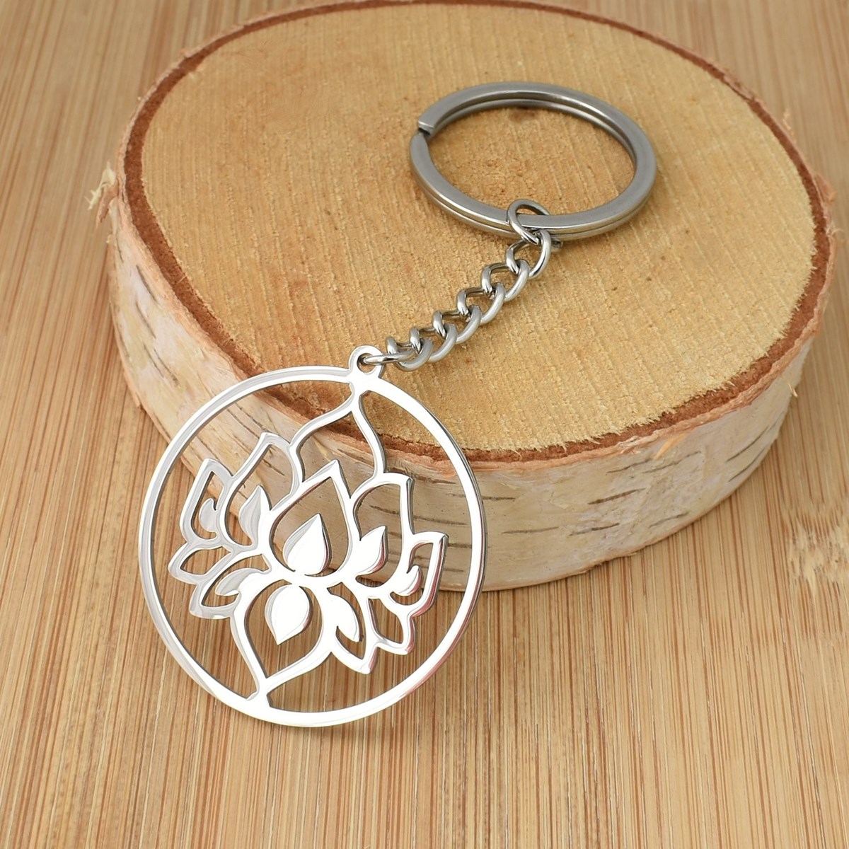 Porte-clés fleur de lotus dans un cercle acier inoxydable