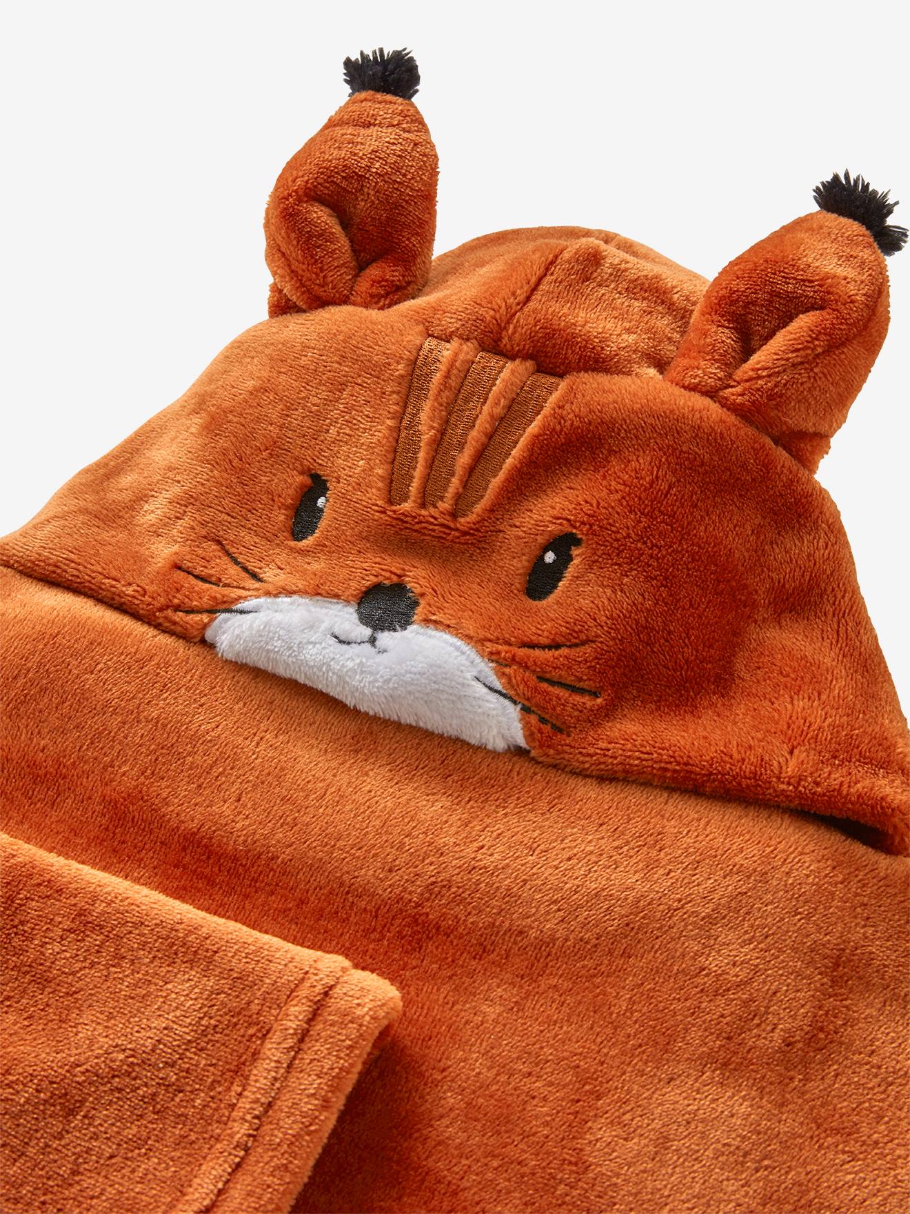 Manta com estampa animal e mangas, lisa em tom médio de roxo com motivos.
