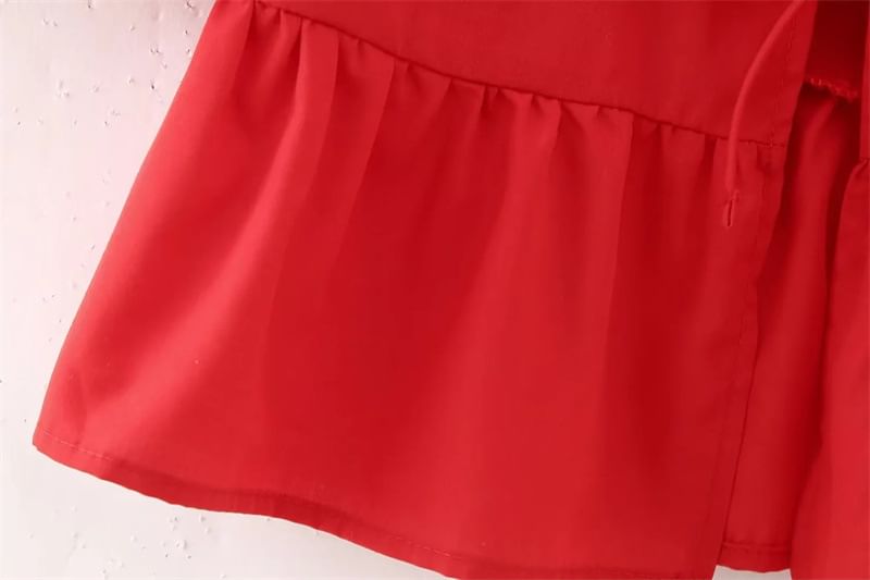 Yukis - Blouse met korte mouwen en peplumstrik aan de voorkant