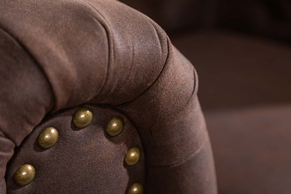 Chesterfield Sessel 110cm vintage braun mit Knopfheftung und Federkern