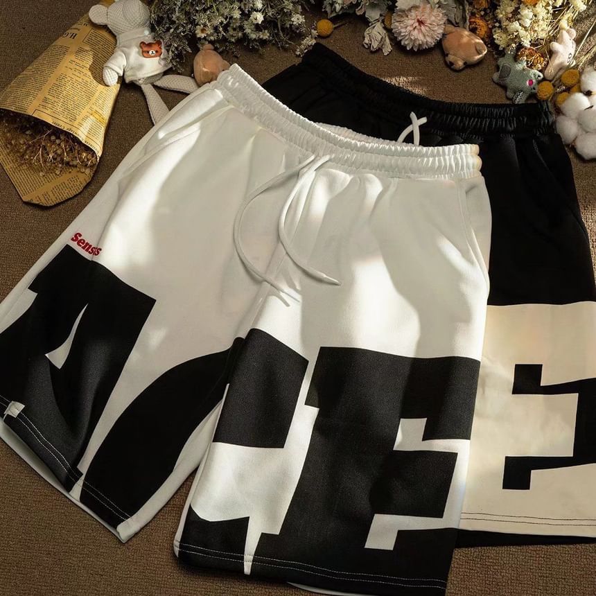 Acrius - Mid Rise Lettering Shorts