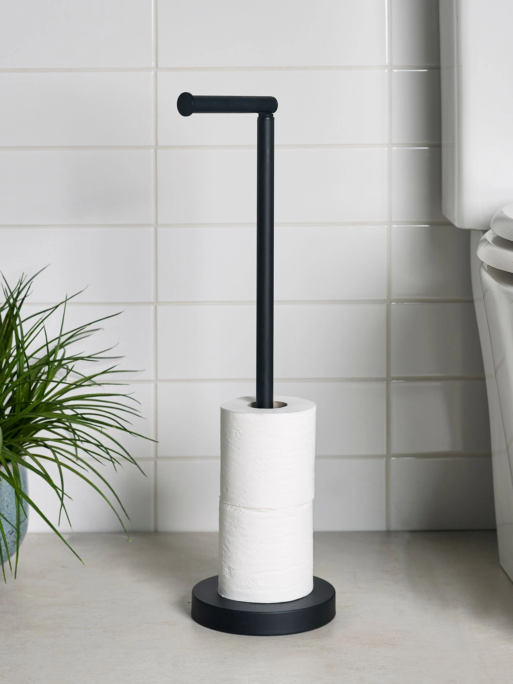 Toiletrolhouder met roterende bovenkant