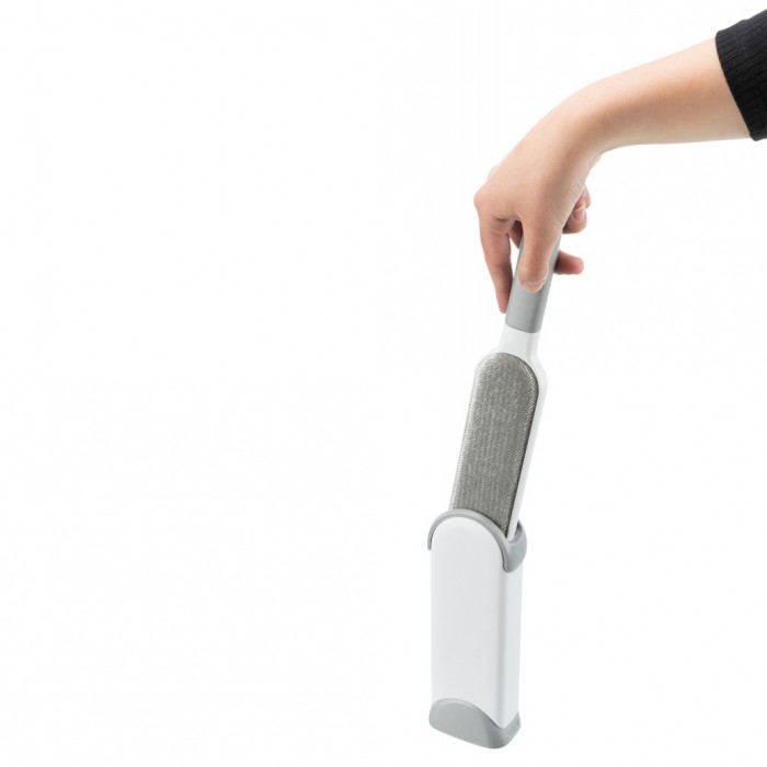 Brosse à peluches avec station de nettoyage