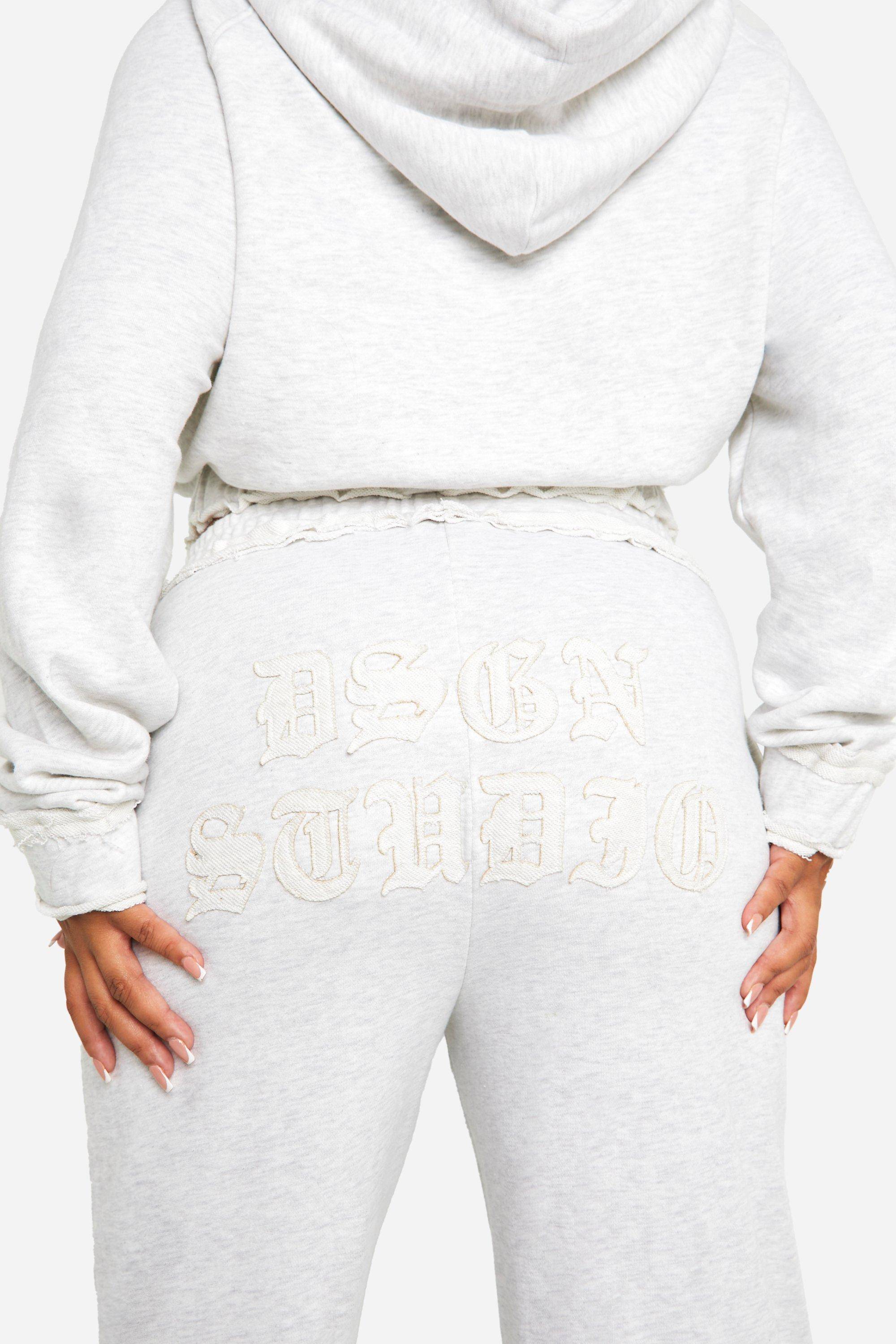 Plus DSGN Studio Self Fabric Applique Jogger à jambe droite distressed
