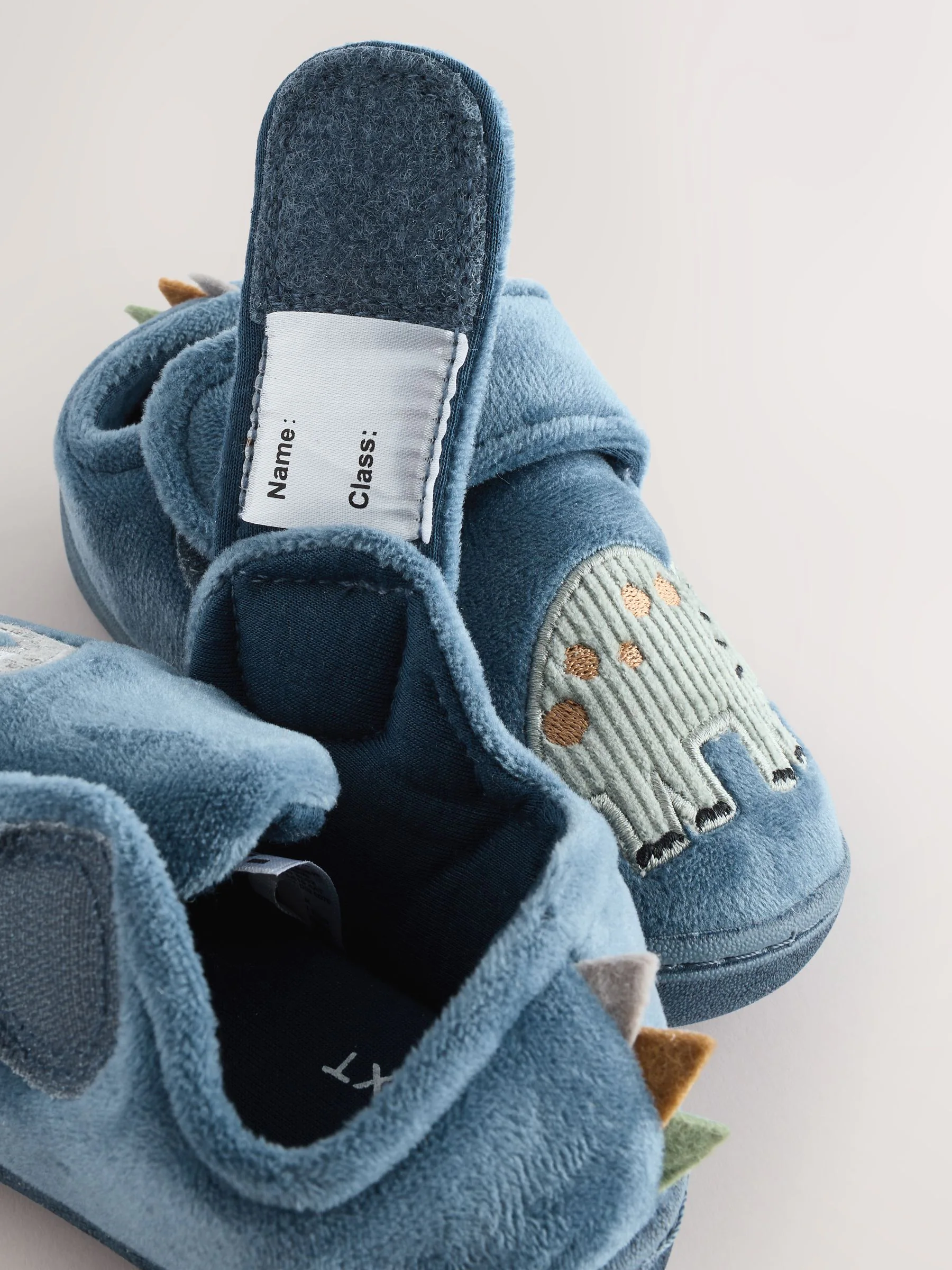 Blauw met dinosaurus - Warm gevoerde pantoffels met kuipzool