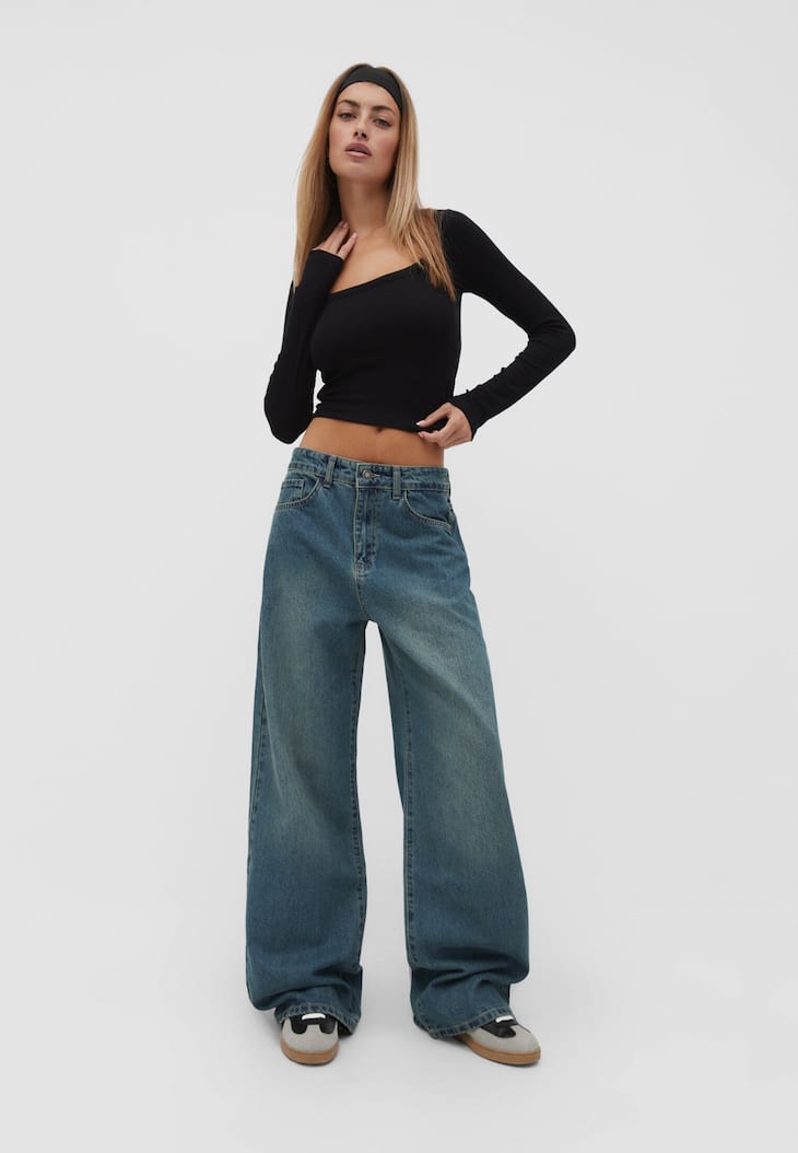 calças jeans de perna larga