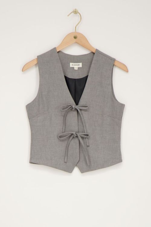Grijs gilet met strikjes