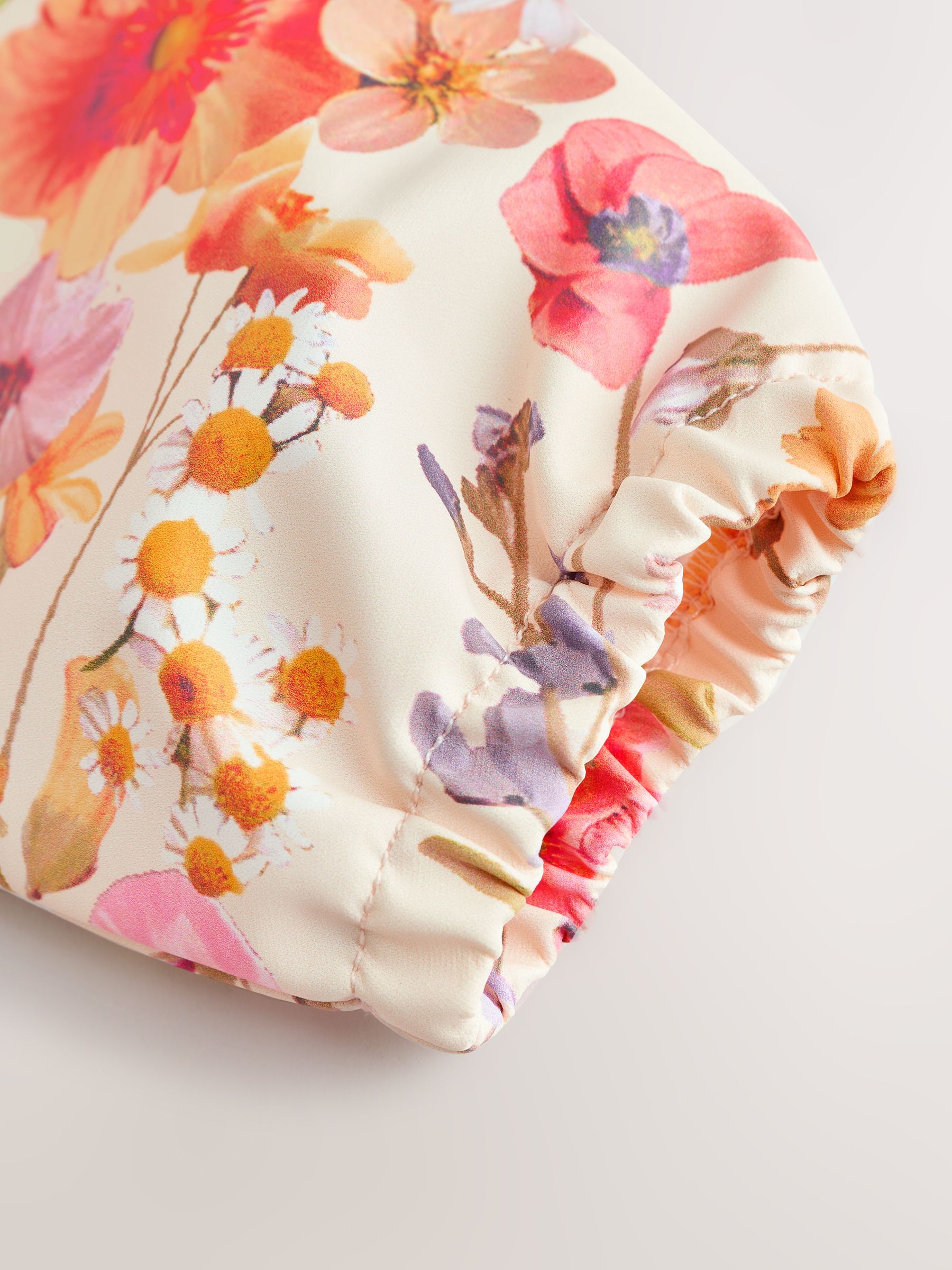 Natuurlijk kalm Bloemen - Slabbetje met mouwen voor spenen en voeden