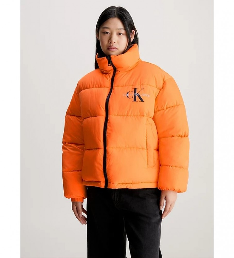 Jaqueta reversível de plumas Calvin Klein Jeans estilo anos 90, preta e laranja.