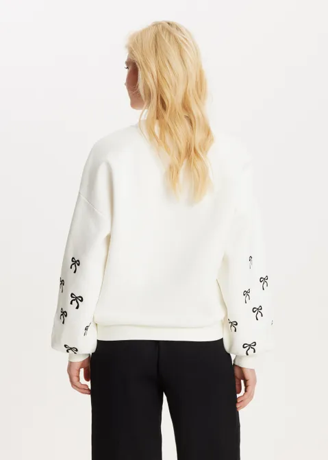 Sweater met print strikjes off-white (WIT.O)