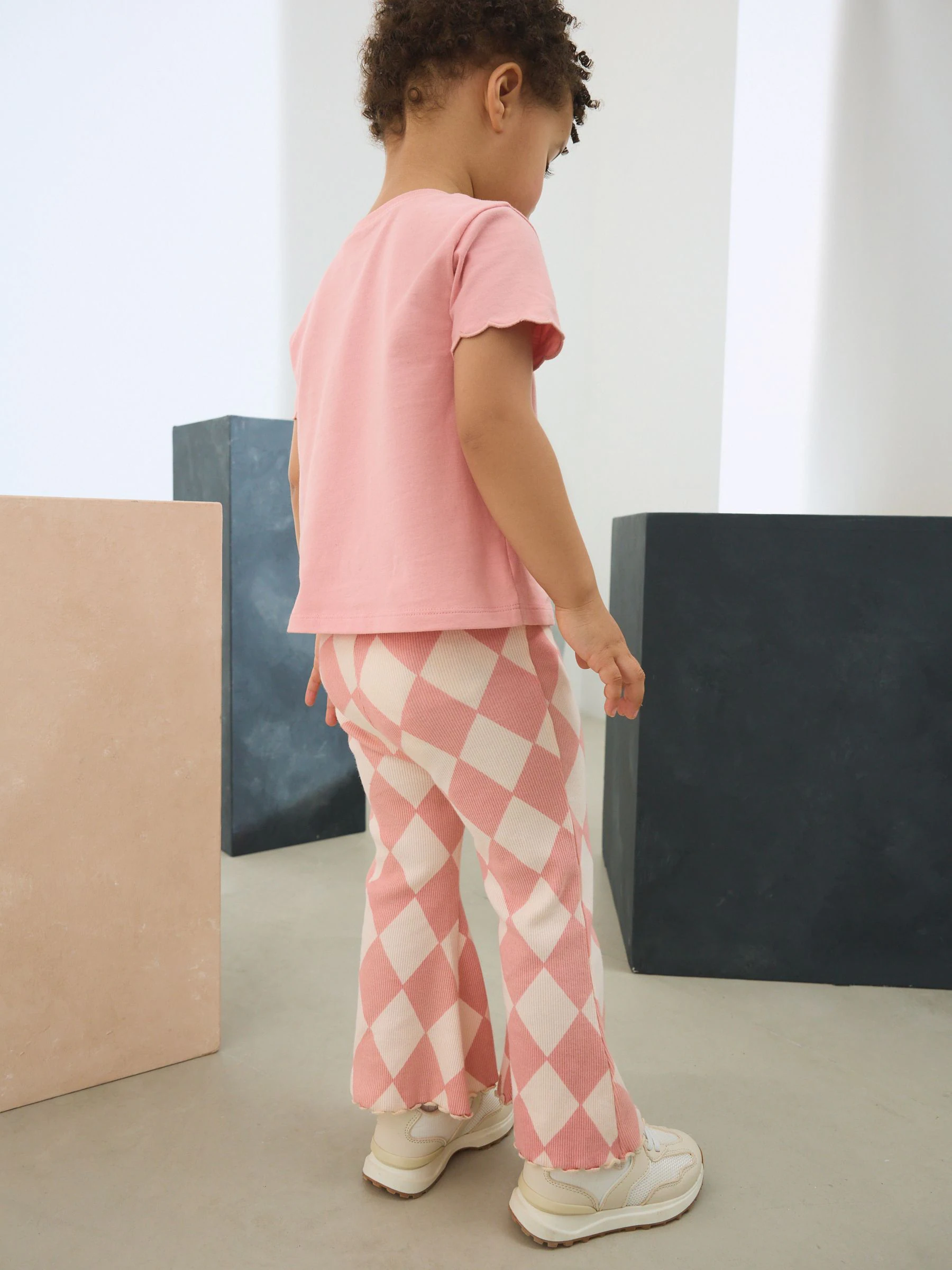 Roze Harlequin - Geribbelde flare legging (3 mnd-7 jr)