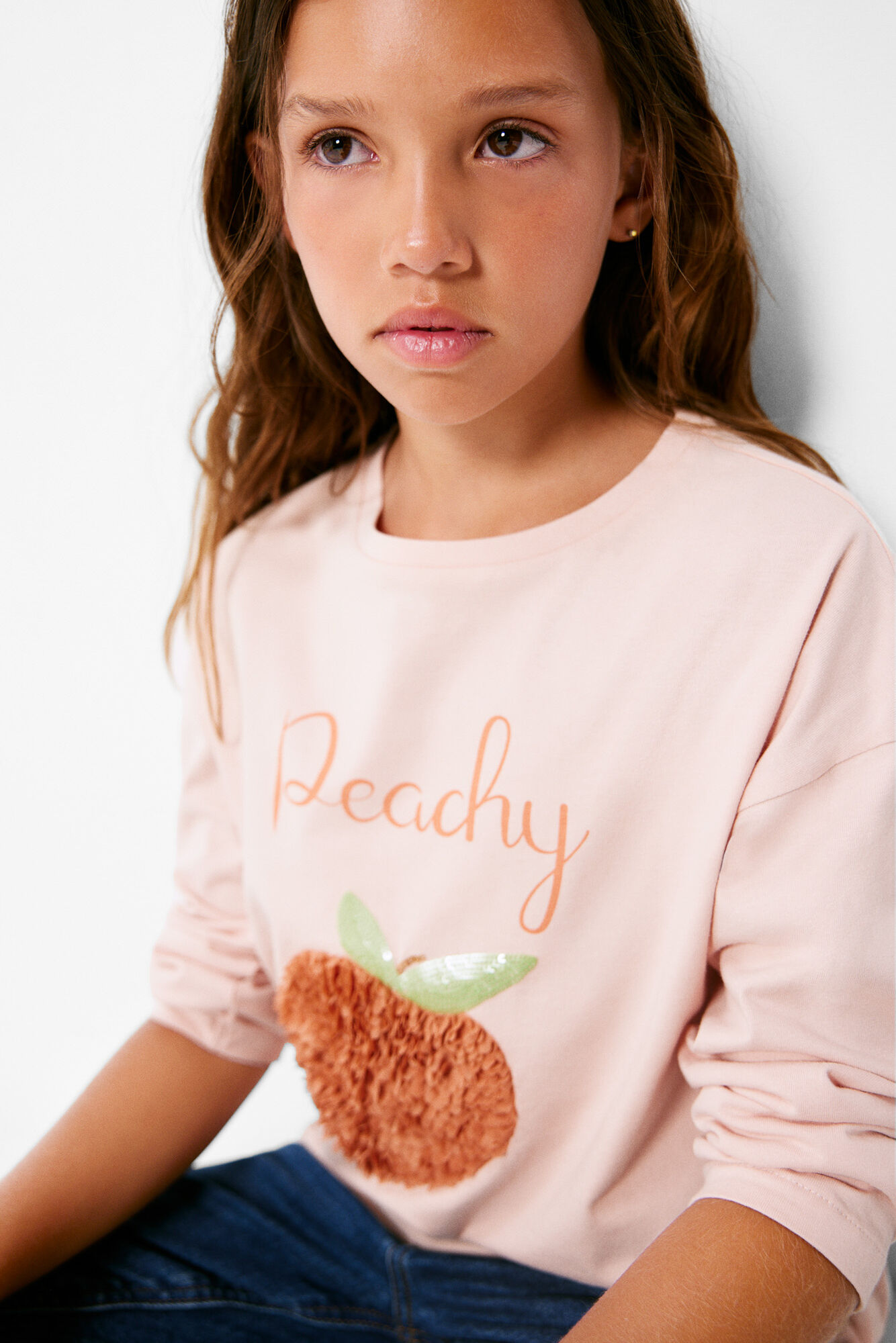 Camiseta cor de pêssego para meninas