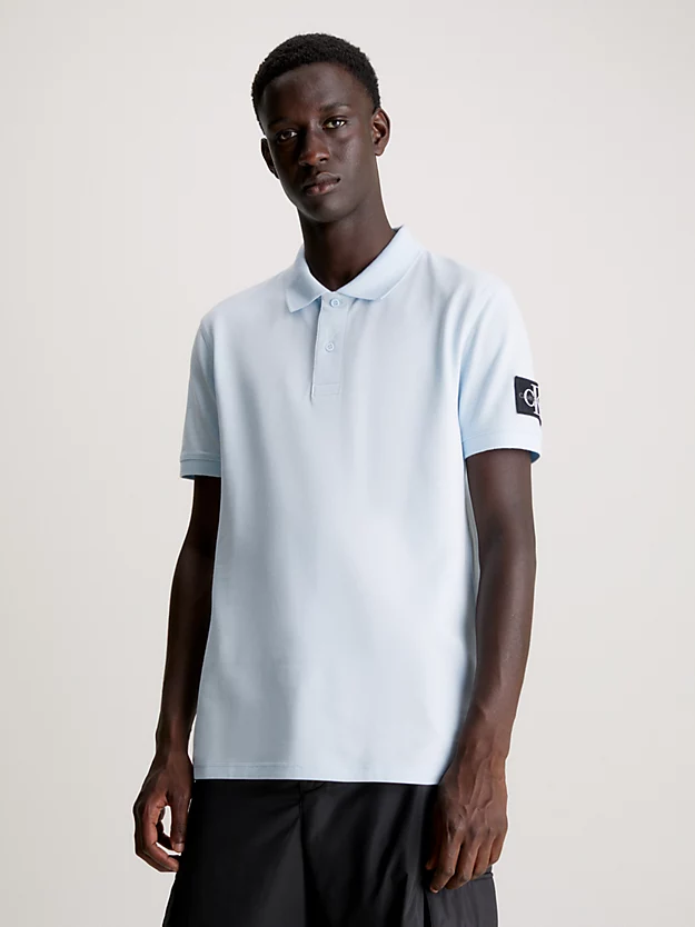 Camisa polo com brasões