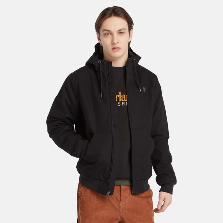 Jaqueta bomber masculina com capuz e isolamento térmico em lona preta.